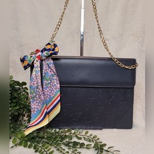 Limited Edition YSL Embossed Monogram Clutch in like new condition